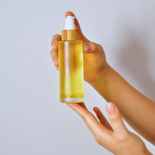 woman hands holding oil cleanser
