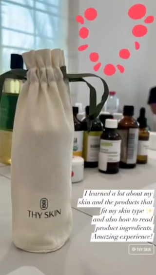 Thy Skin  workshop product bag on a table with skincare bottles in the background