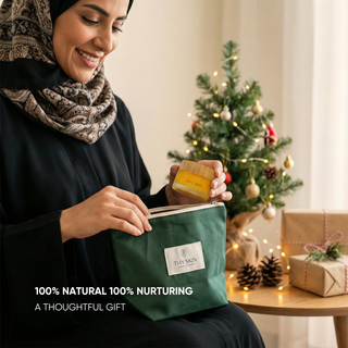 Woman holding a green bag with a product, Christmas tree in the background